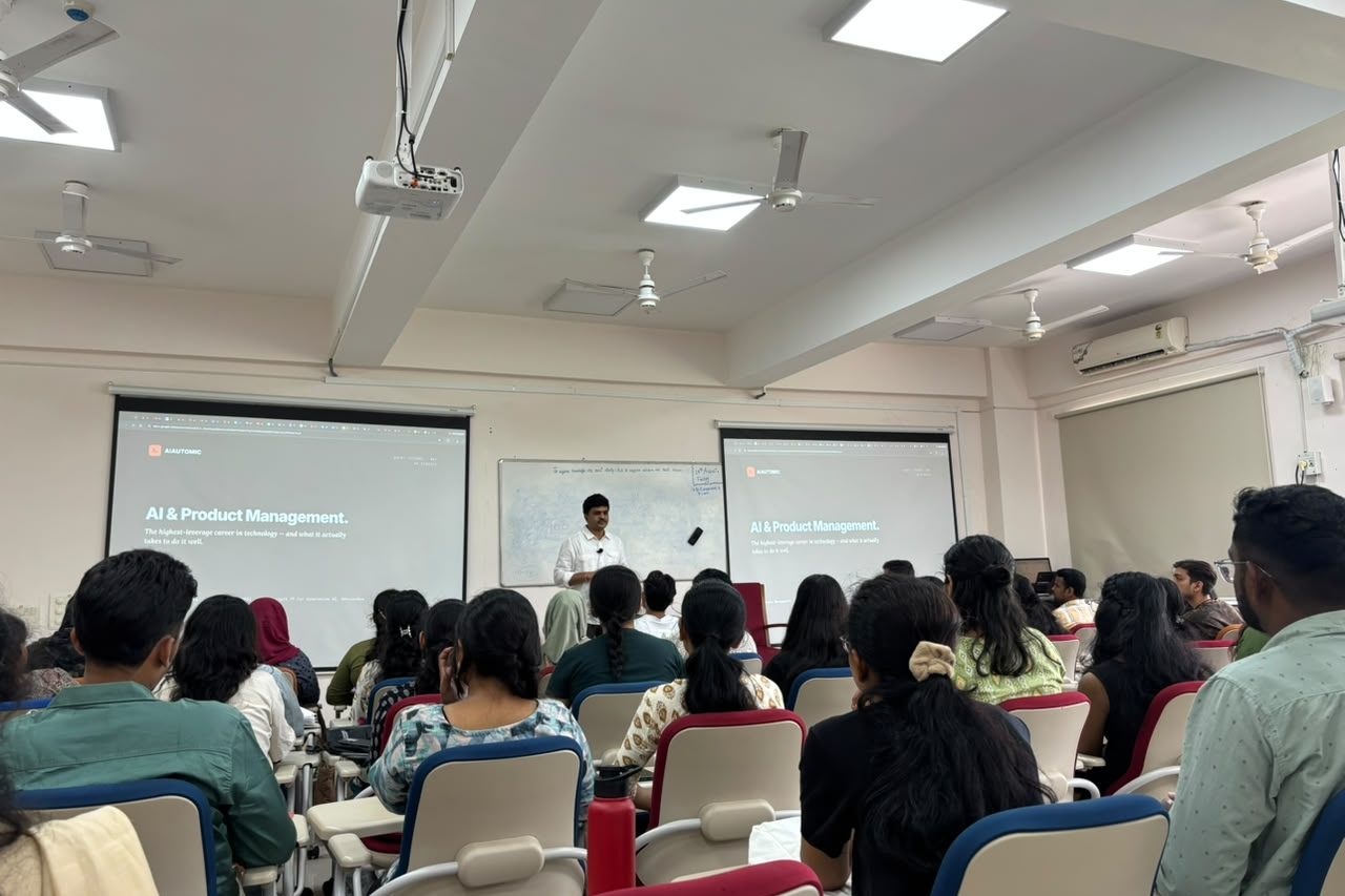 Sheshakanth Munagapati delivering an AI and product management guest lecture to a full room of MBA students at the University of Hyderabad